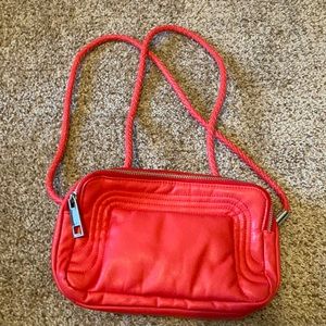 Mark. Red adjustable purse